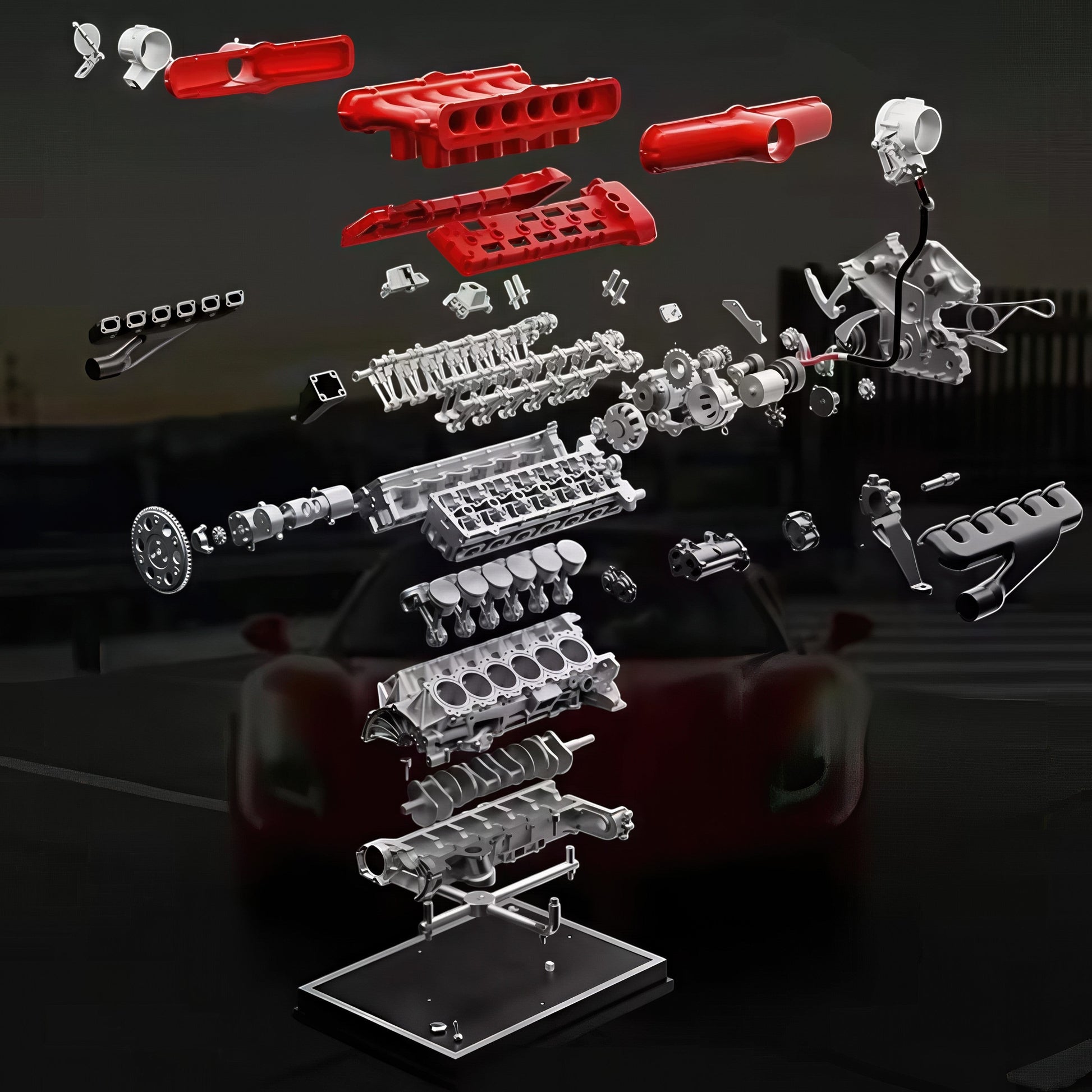 The Curious Mind V12 Car Engine DIY Kit, a metal mechanical model with red and silver parts, displayed disassembled.