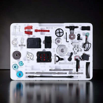 The Curious Mind Vintage Classic Car DIY Kit metal mechanical model parts laid out in a white tray. Includes gears, screws, and electronic components.