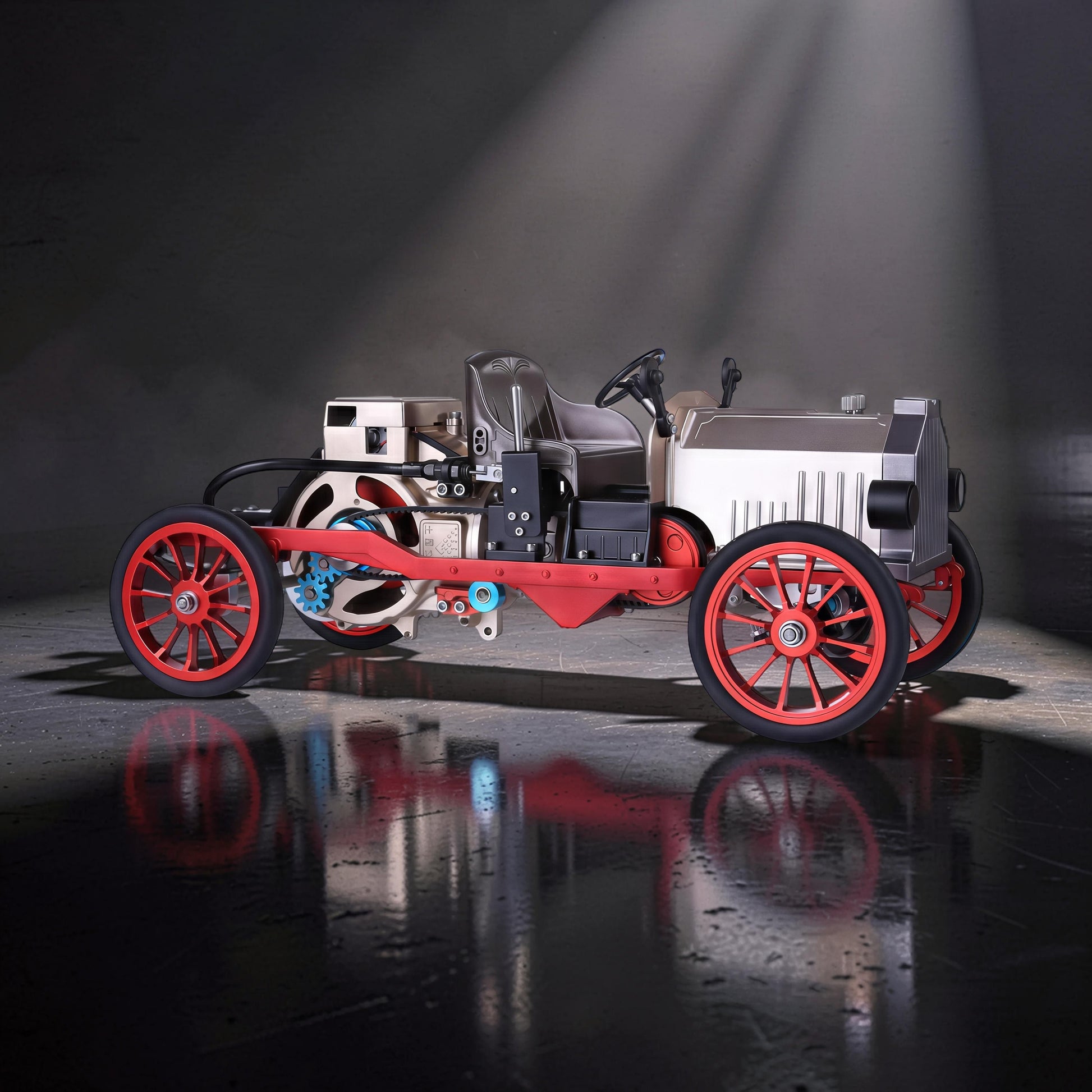 The Curious Mind vintage classic car DIY kit, a metal mechanical model with red wheels and frame, silver body, and visible gears.