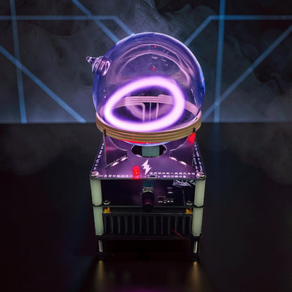 The Curious Mind Xenon Ion Ring Glass Sphere displays a purple plasma ring inside a glass orb on a metal and plastic base.