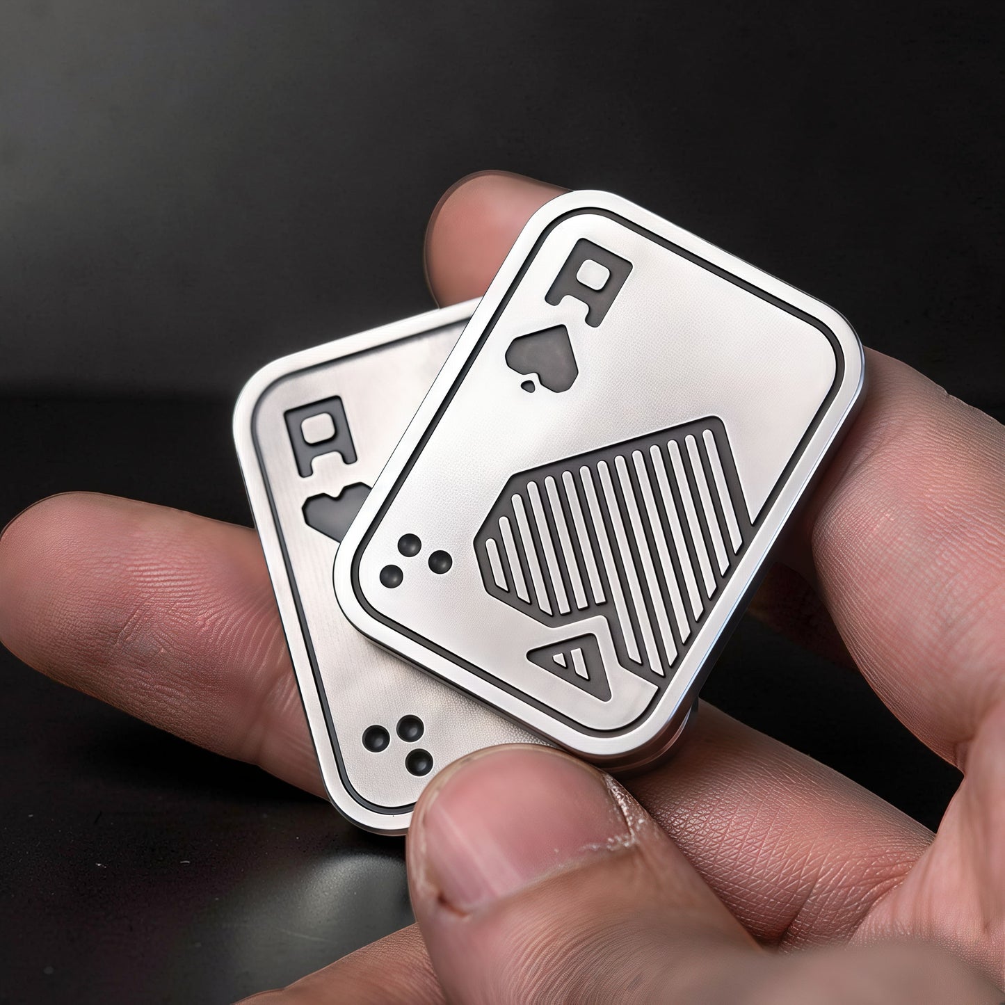 The Curious Mind Ace of Spades metal slider fidget toy, silver, compact design with tactile push-and-return motion.