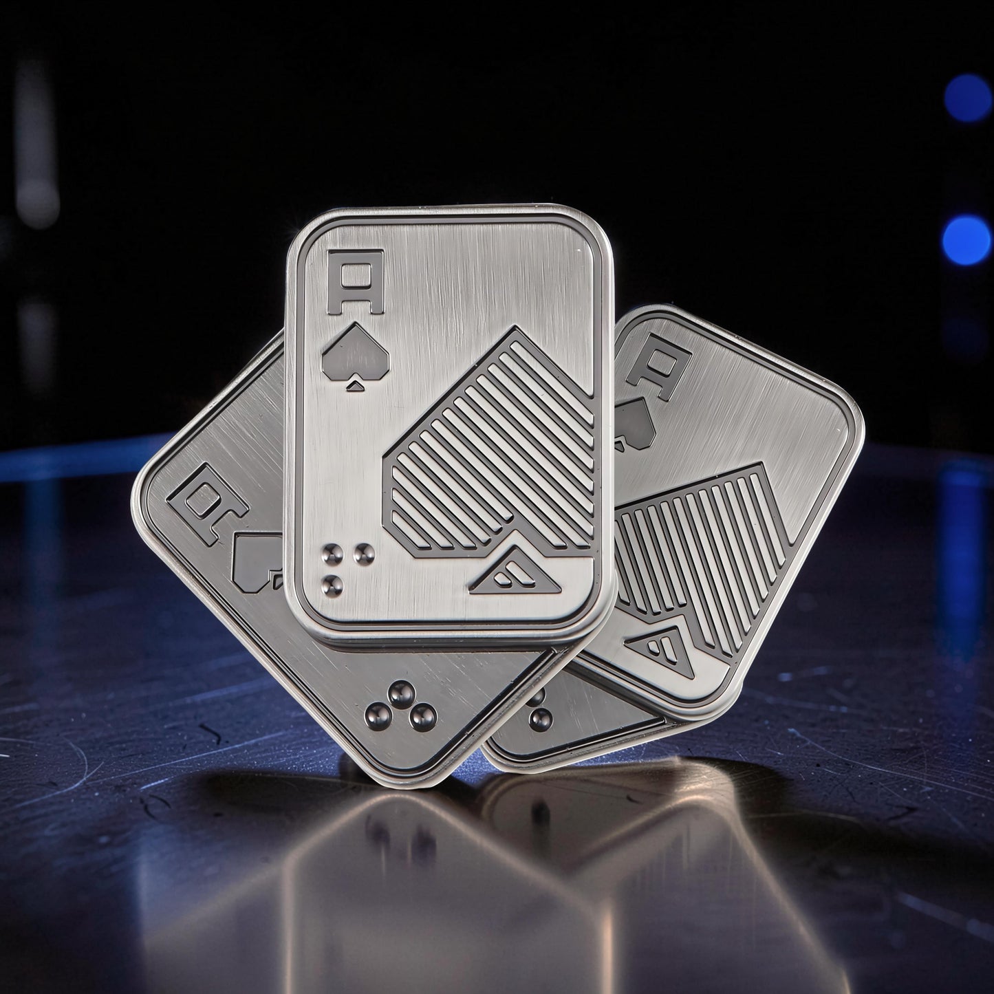 The Curious Mind Ace of Spades metal slider fidget toy, brushed silver with engraved spade design. Compact and tactile.