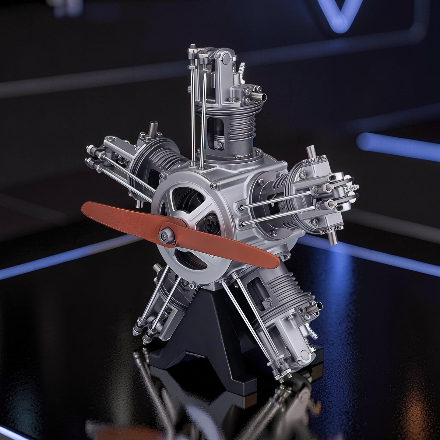 The Curious Mind 5-cylinder aircraft radial engine mechanical model kit, made of metal, with a brown propeller and black stand.
