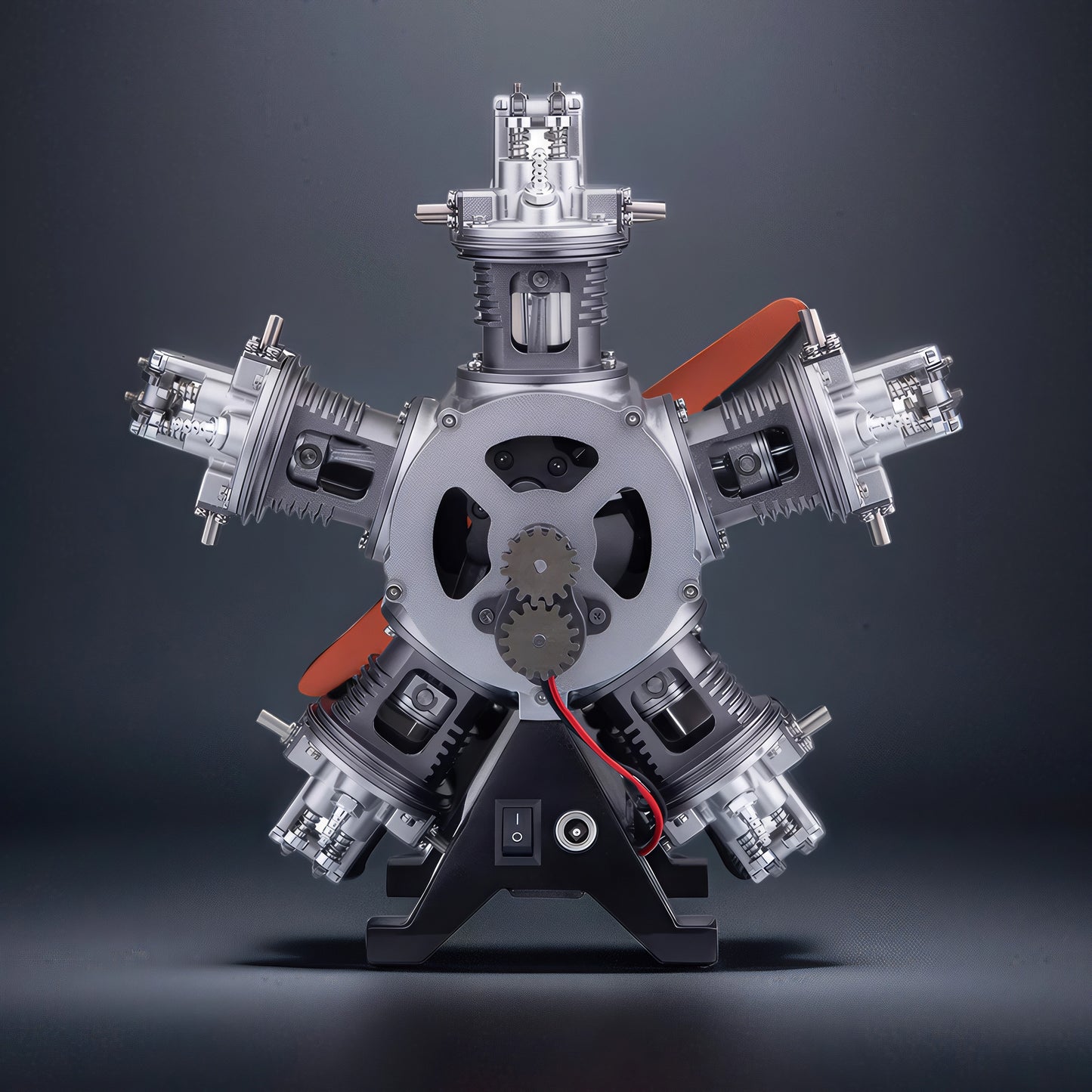 The Curious Mind 5-cylinder aircraft radial engine DIY kit, a detailed metal mechanical model with orange accents and a black display stand.