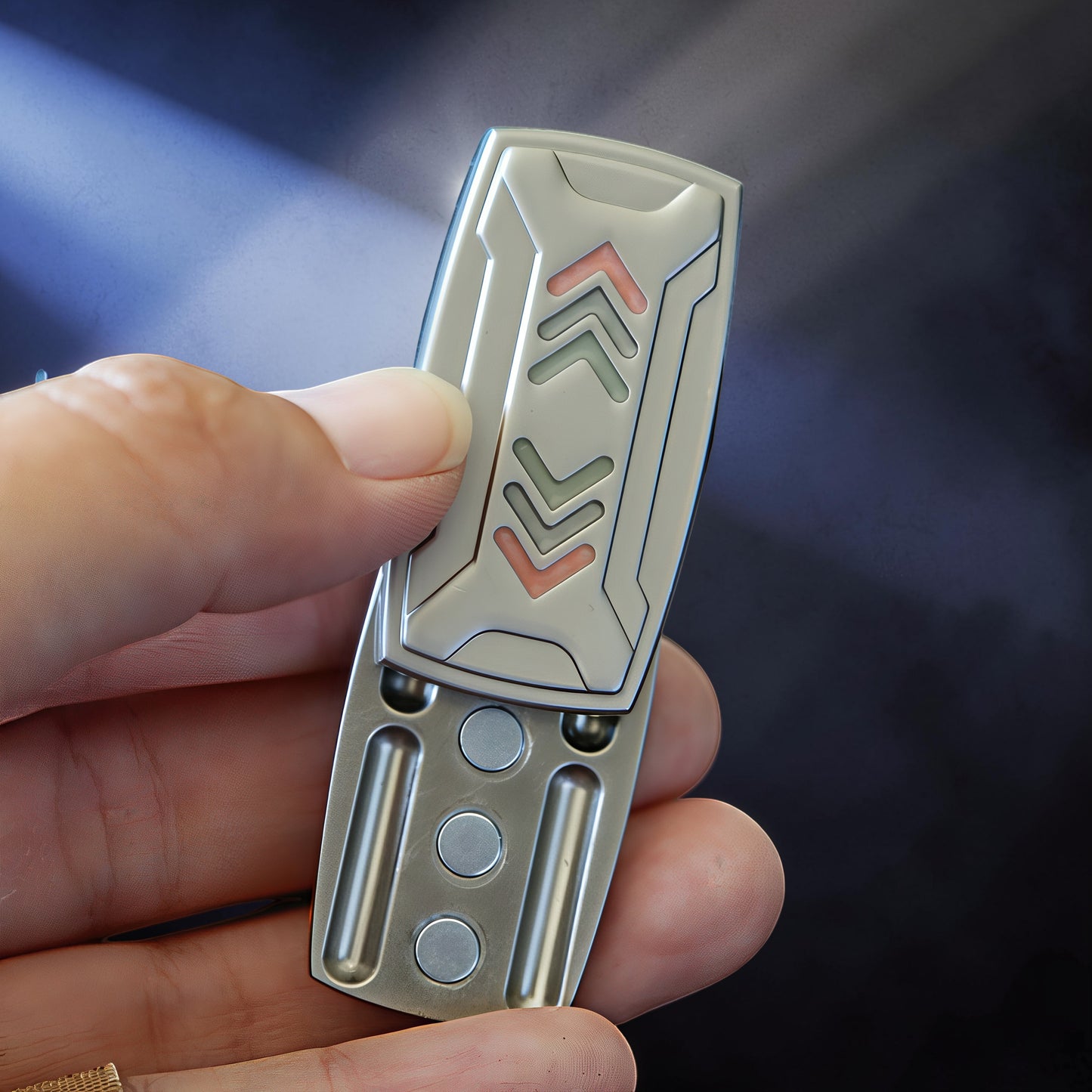 The Curious Mind Arrow Pusher Click Slider fidget toy with metallic silver finish and red/green arrow accents.