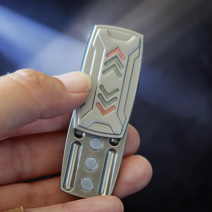 The Curious Mind Arrow Pusher Click Slider fidget toy with metallic silver finish and red/green arrow accents.