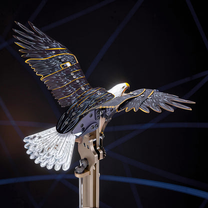 The Curious Mind Bald Eagle Flapping Wings DIY Kit, a metal mechanical model with intricate details and gold accents.