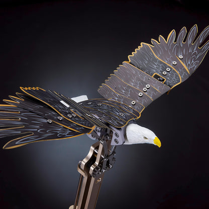 The Curious Mind Bald Eagle mechanical model kit with flapping wings, detailed metal construction, and realistic feather design.