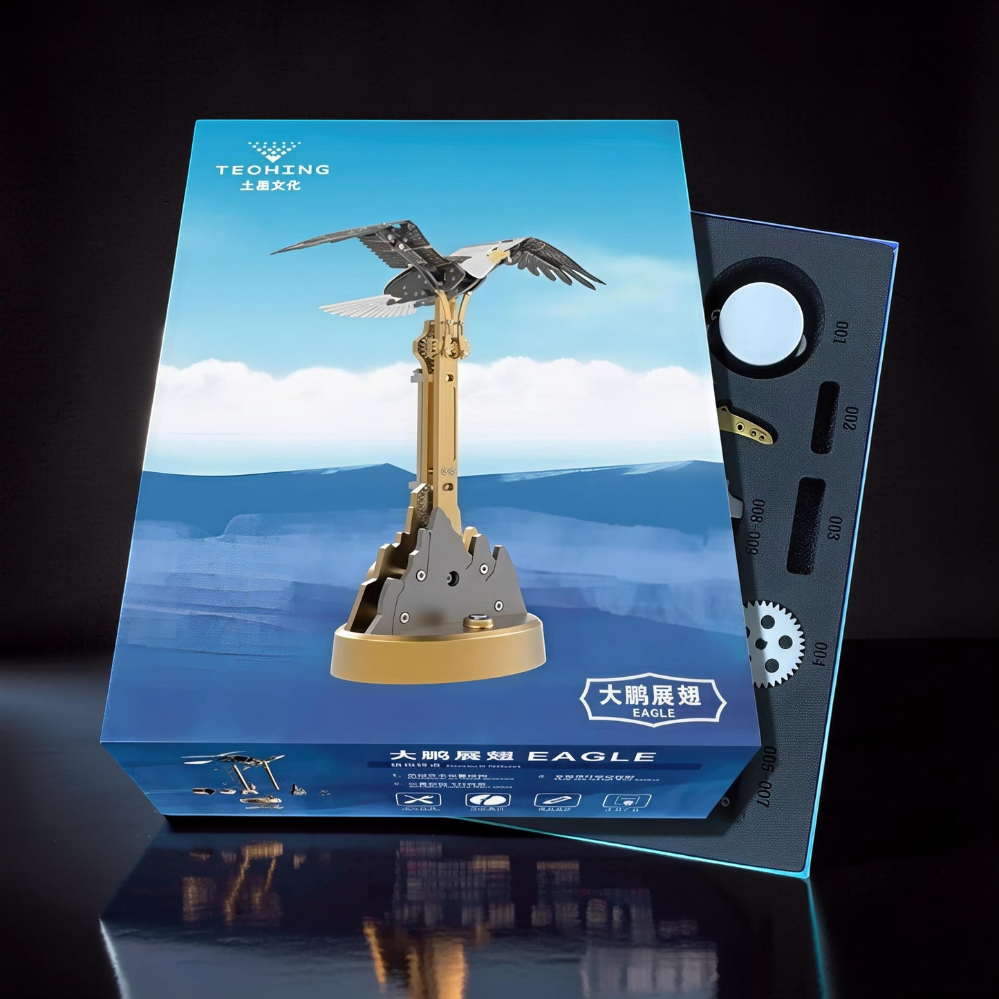 The Curious Mind Bald Eagle Flapping Wings DIY Kit is a metal mechanical model with intricate gears and a gold and grey finish.
