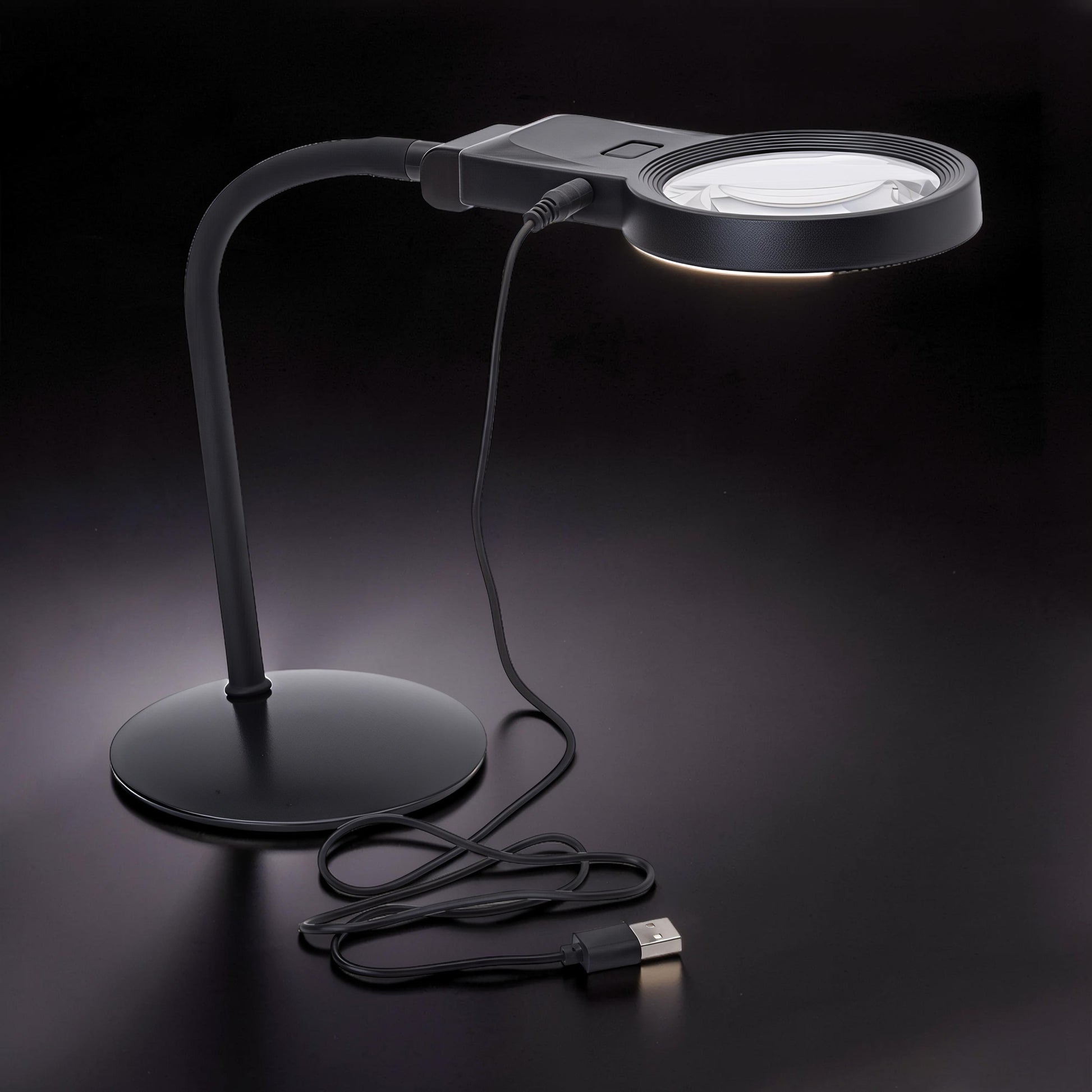 The Curious Mind black gooseneck LED magnifier desk lamp with adjustable neck for hobby work.