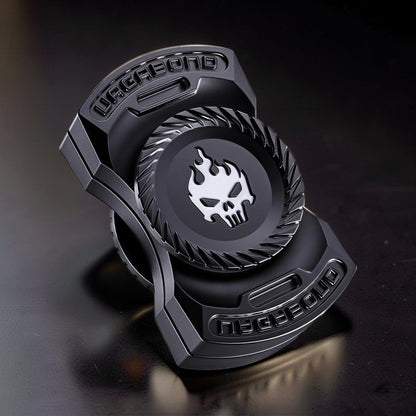 The Curious Mind Butterfly Plus Metal Spinner in black features a skull with flames emblem and "VAGABOND" text. Premium EDC fidget toy.
