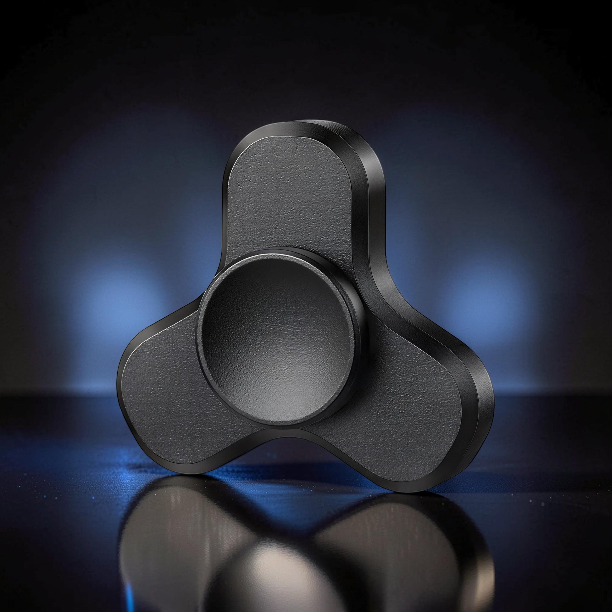 The Curious Mind Mini Elf Hand Spinner, a premium black metal EDC fidget toy with a balanced profile for smooth rotation.