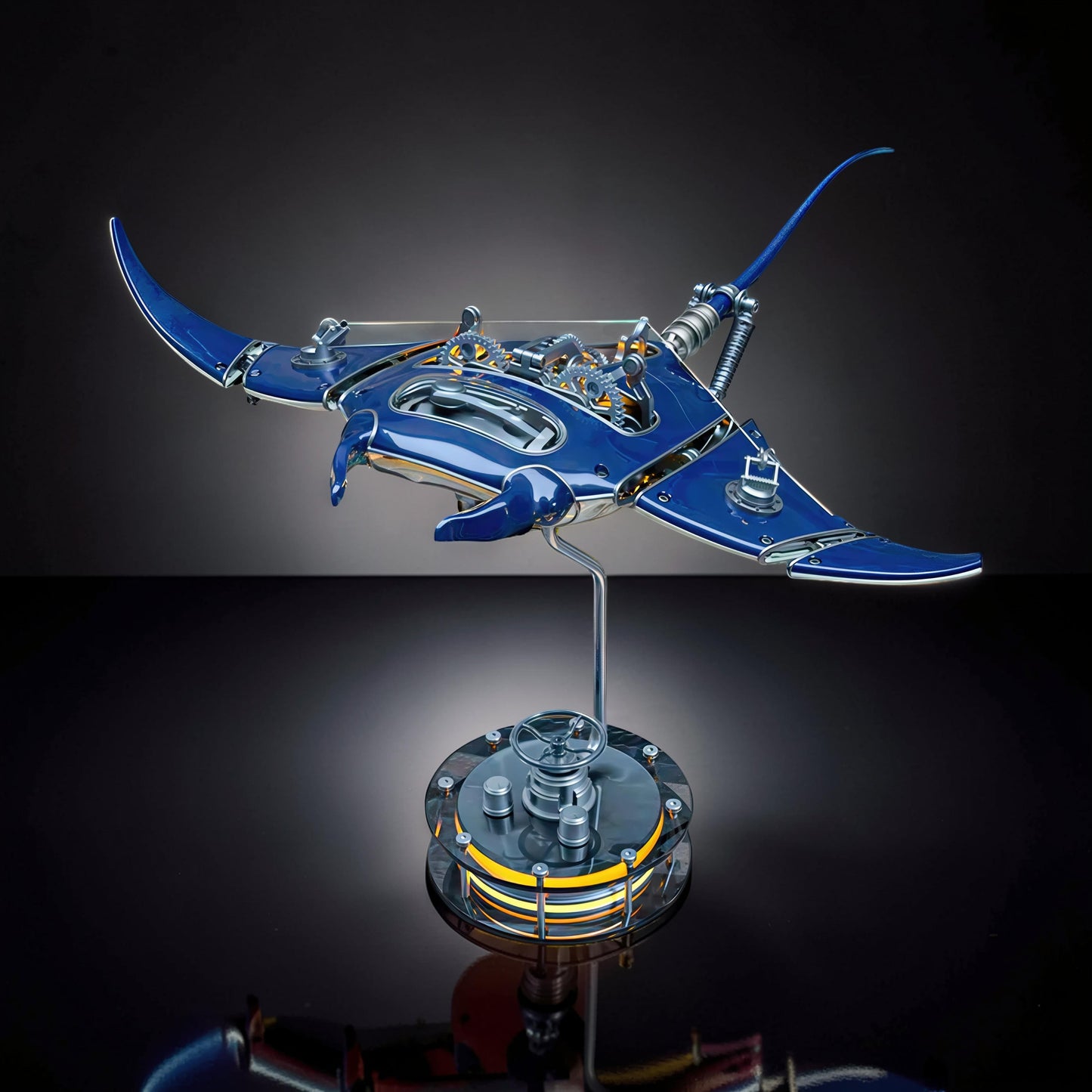 The Curious Mind Manta Ray DIY Kit is a detailed mechanical ocean creature model made of blue metal with intricate gears and a display stand.