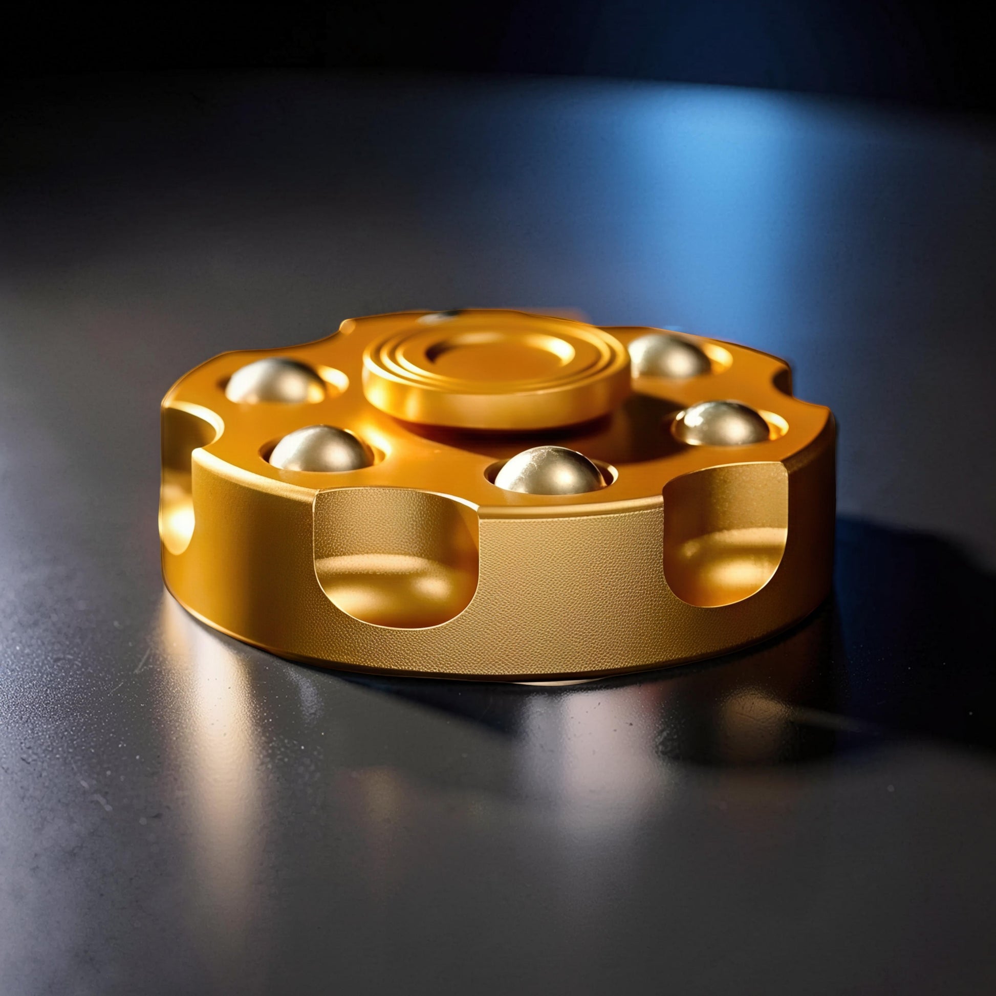 The Curious Mind brass finger gyro spinner with gold finish and six ball bearings for smooth rotation.