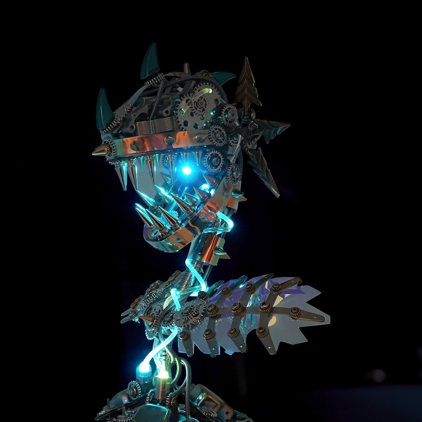 The Curious Mind Cannibal Flower steampunk 3D metal model kit, a metallic creature with sharp teeth and glowing blue lights.