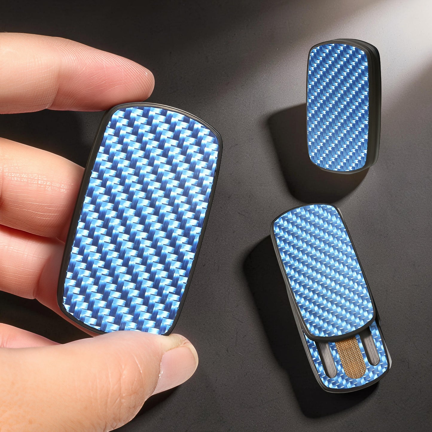 The Curious Mind Carbon Fiber Magnetic Slider fidget toy with blue carbon fiber pattern. Compact and tactile.