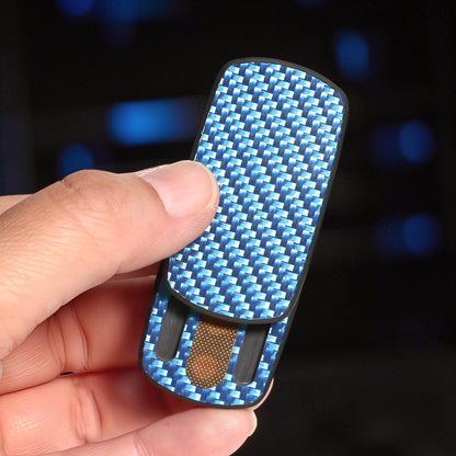 The Curious Mind carbon fiber magnetic slider fidget toy with blue weave pattern, held in hand.