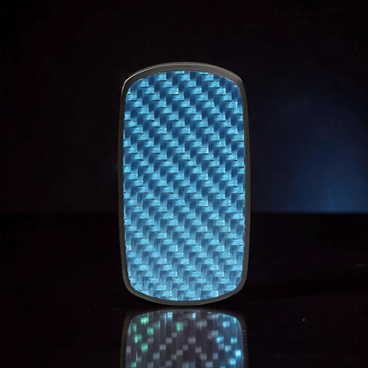 The Curious Mind Carbon Fiber Magnetic Slider with blue woven pattern and silver trim.