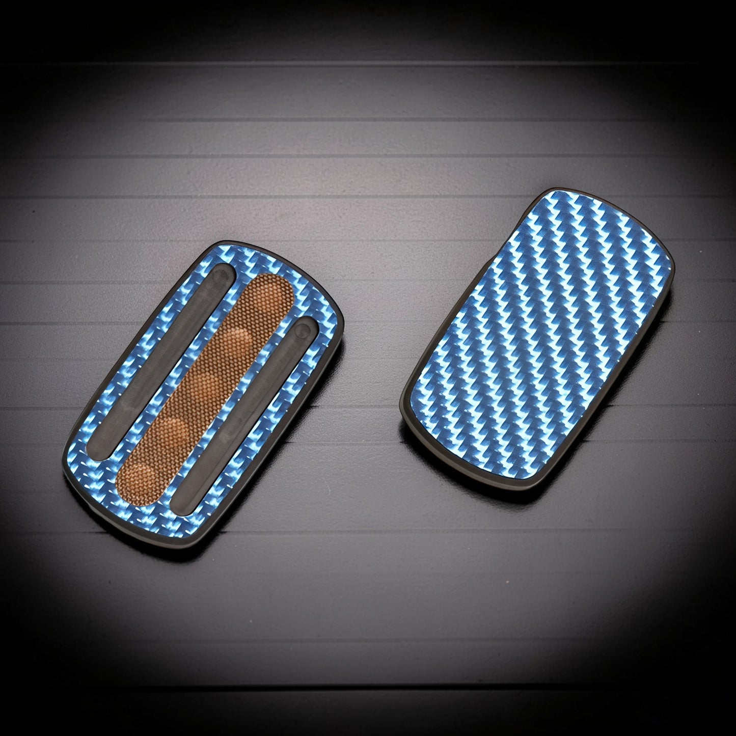 The Curious Mind Carbon Fiber Magnetic Slider fidget toy with blue carbon fiber pattern and tactile grip.