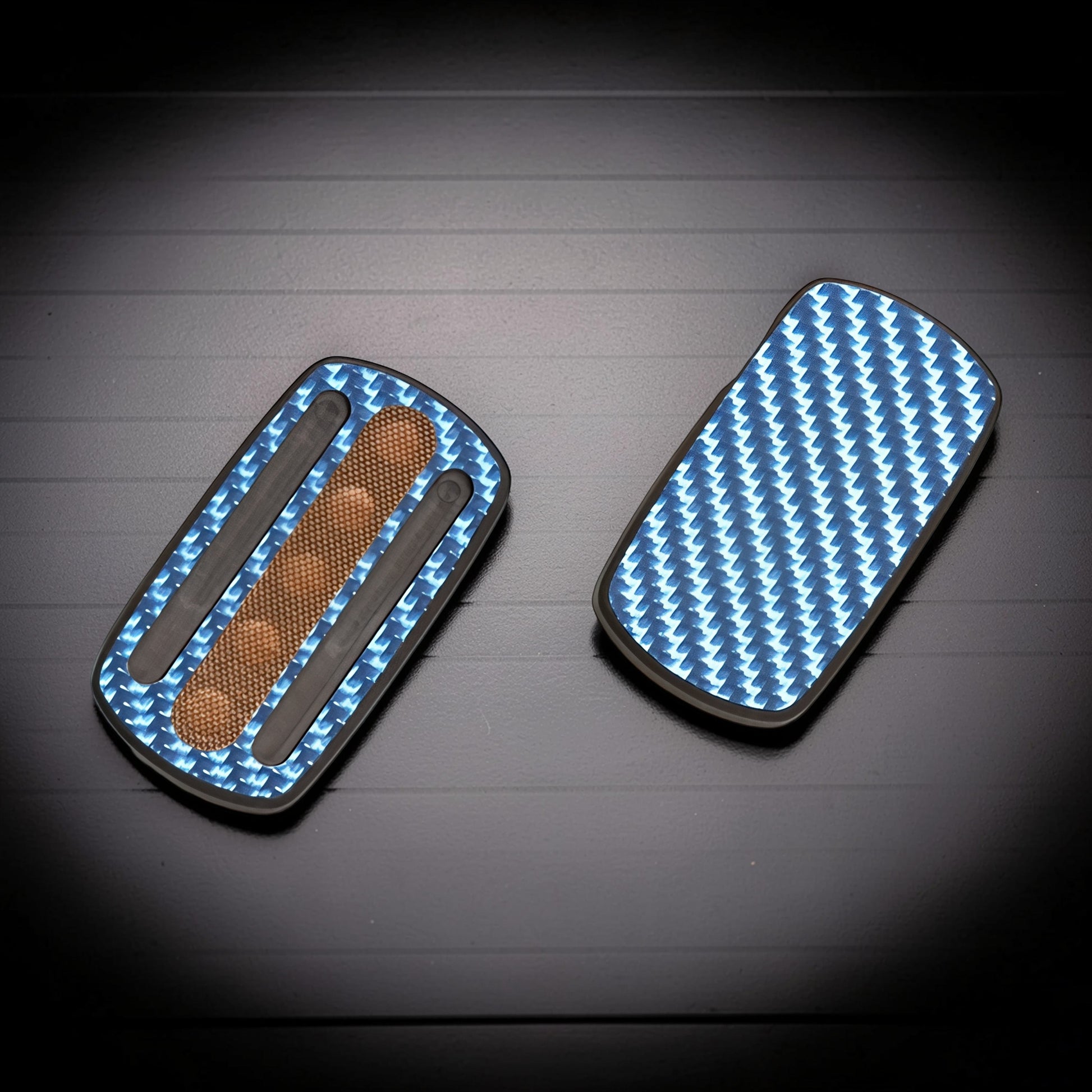 The Curious Mind Carbon Fiber Magnetic Slider fidget toy with blue carbon fiber pattern and tactile grip.