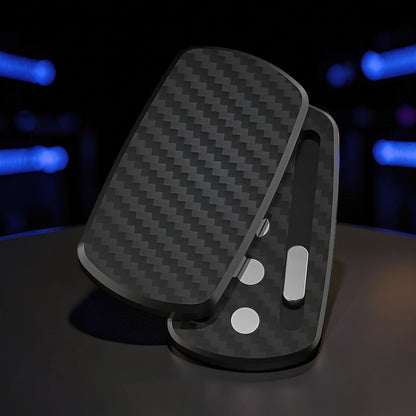 The Curious Mind Carbon Fiber Magnetic Slider fidget toy with a sleek, textured black finish and silver accents.