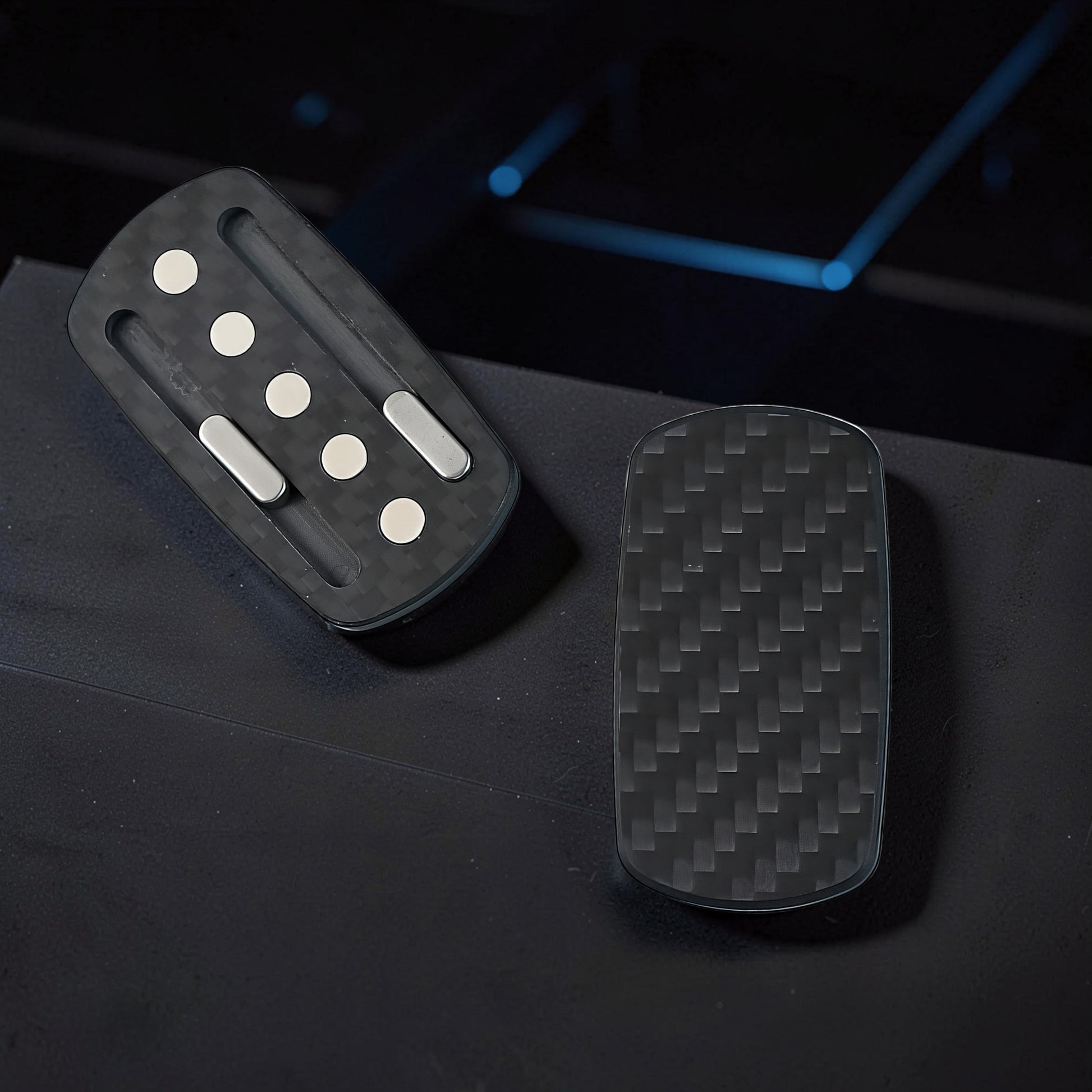 The Curious Mind Carbon Fiber Magnetic Slider fidget toy with tactile magnetic push-and-return action.