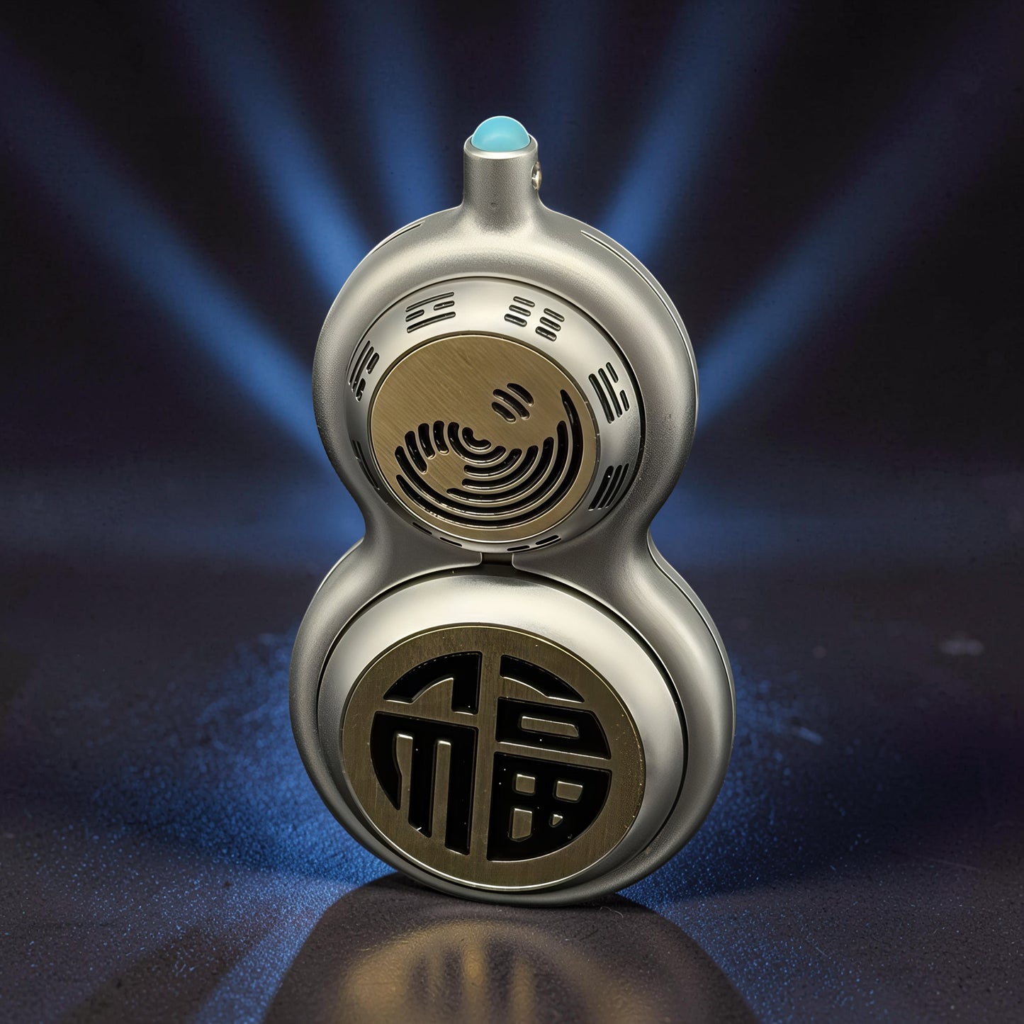 The Curious Mind Cucurbit Gourd Spinner, a silver metal fidget toy with gold accents and a blue gem top. Features Chinese characters and a yin-yang symbol.