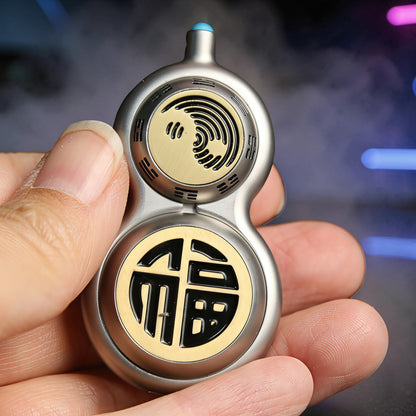 The Curious Mind Cucurbit Gourd Spinner, a silver metal fidget toy with gold accents featuring Chinese characters and a spiral design.