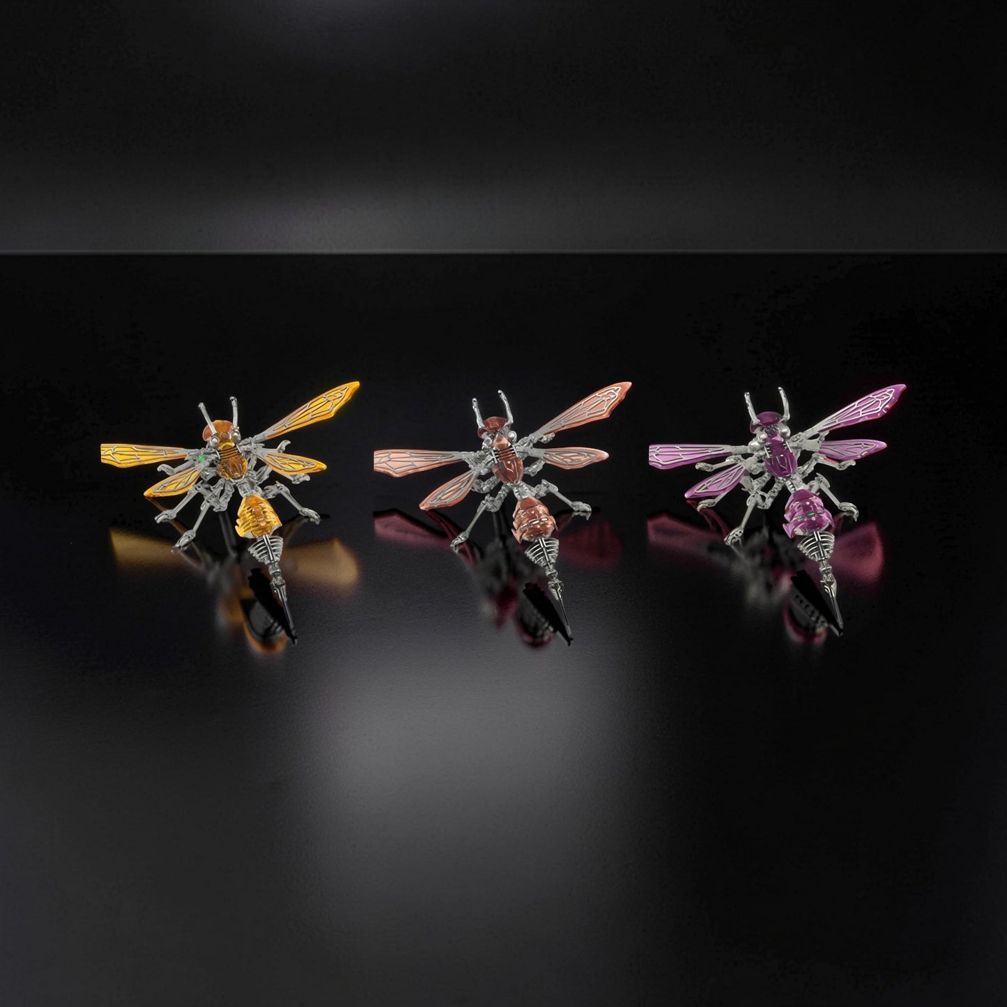 The Curious Mind Cyberpunk Hornet 3D metal model kit in yellow, pink, and purple. Intricate mechanical insect design with metallic wings and segmented bodies.
