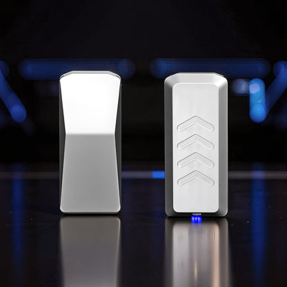 The Curious Mind Cyberpunk Truck Push Slider fidget toy, compact silver metal with chevron design and blue LED light.