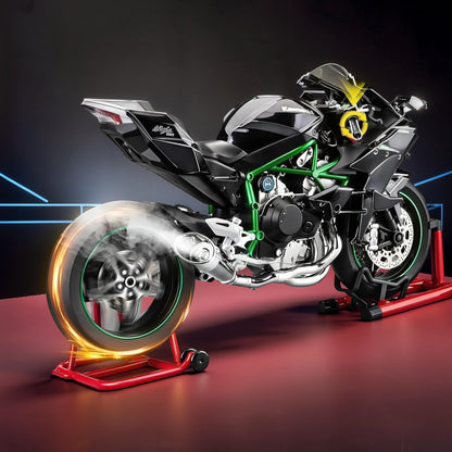 The Curious Mind 1/6 scale diecast motorcycle model in black with green frame details, on a red display stand.