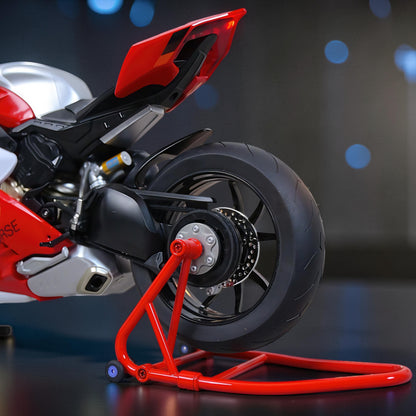 The Curious Mind 1/6 diecast motorcycle model in red and silver, displayed on a red stand.