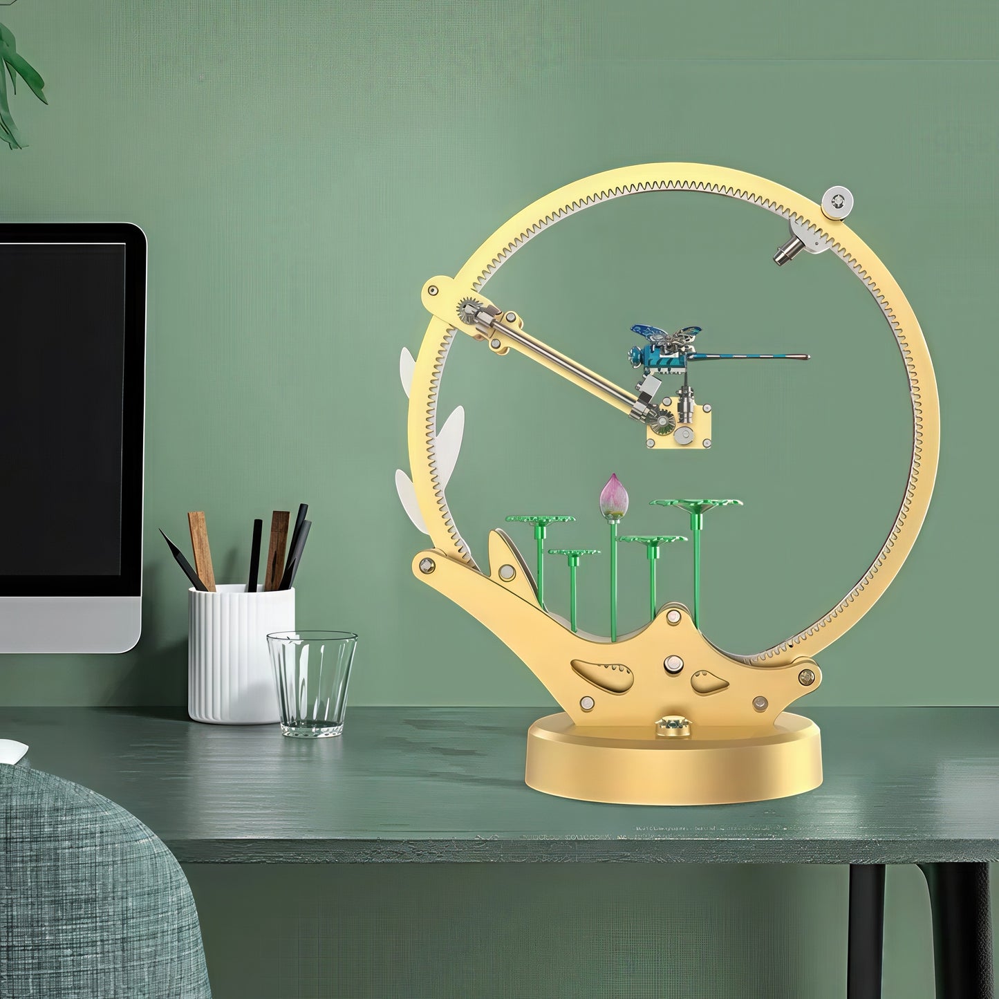 The Curious Mind Flying Dragonfly Kinetic DIY Kit, a gold metal mechanical model with a blue dragonfly and lotus flower detail.