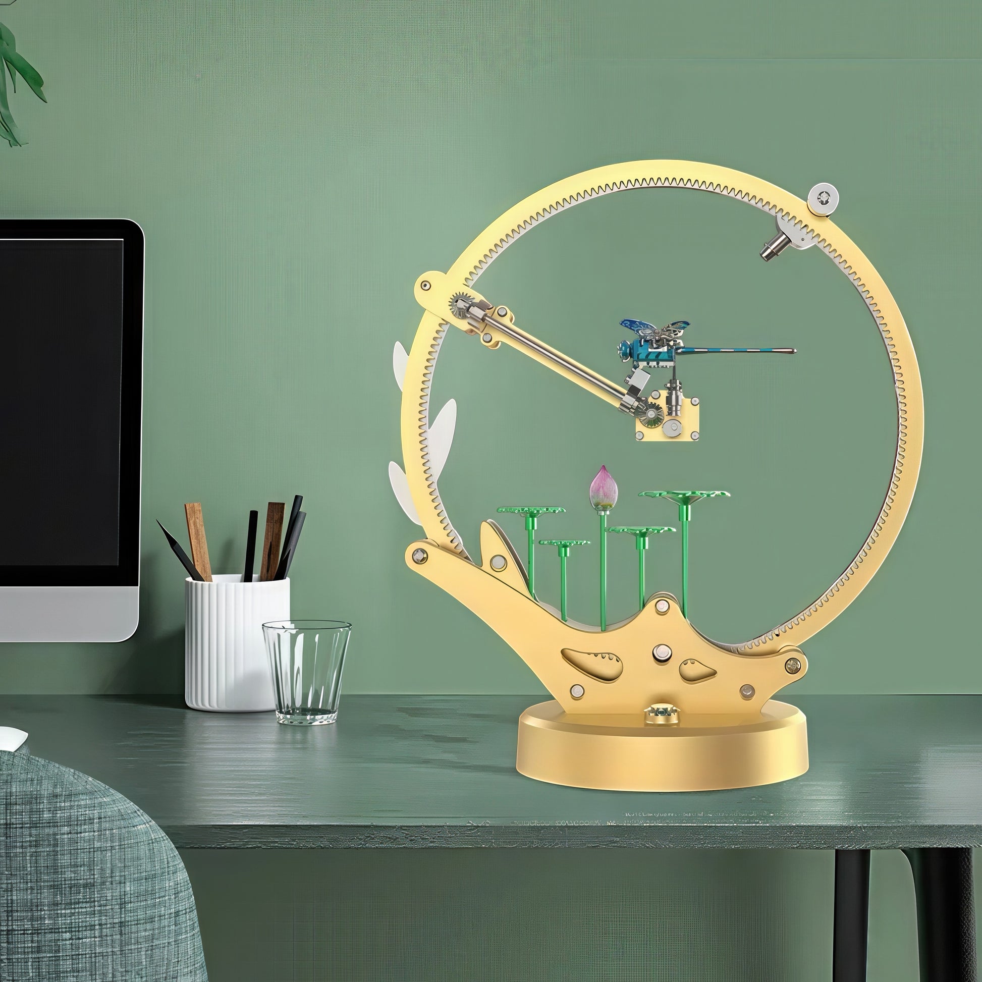 The Curious Mind Flying Dragonfly Kinetic DIY Kit, a gold metal mechanical model with a blue dragonfly and lotus flower detail.