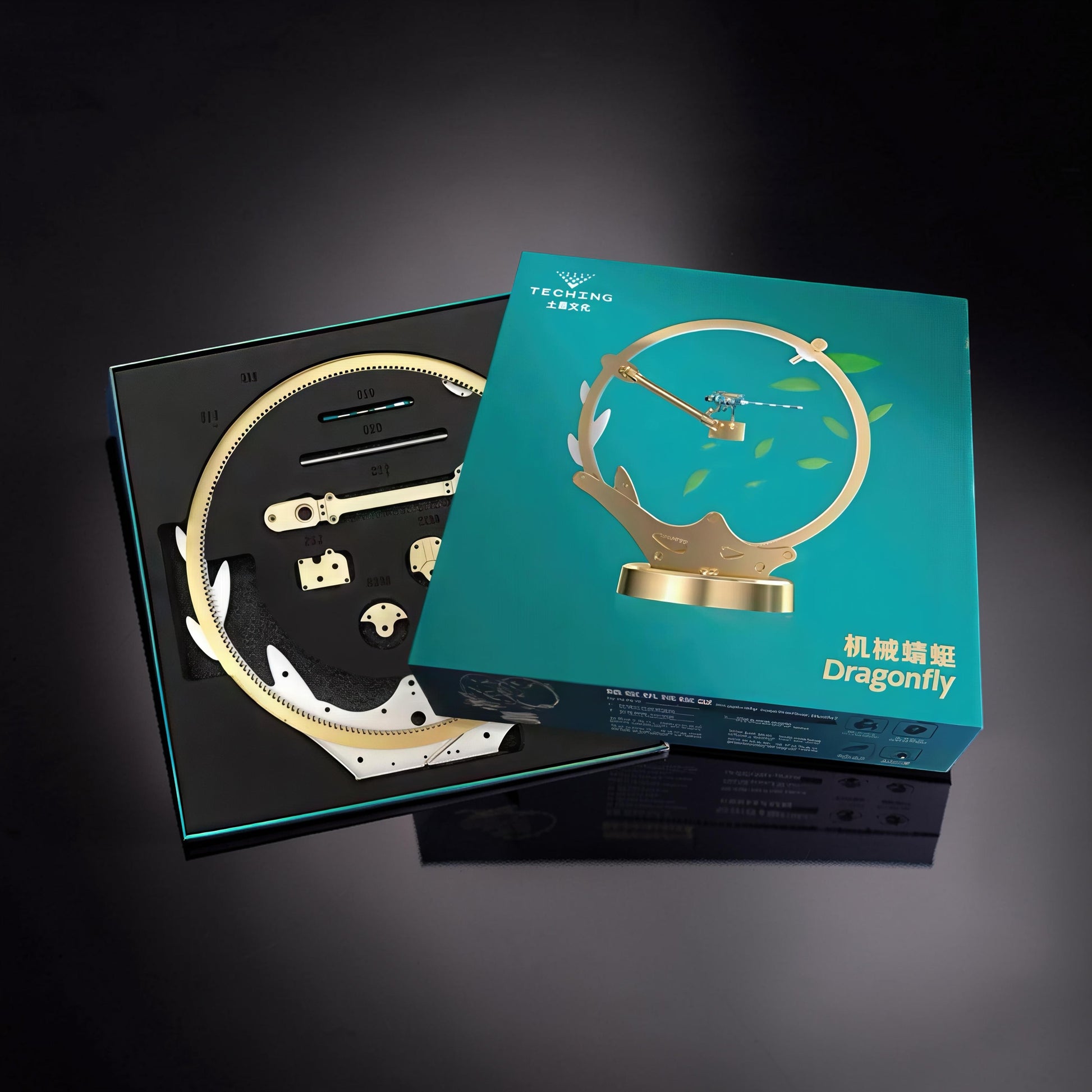 The Curious Mind Flying Dragonfly Kinetic DIY Kit with metal parts and display box.