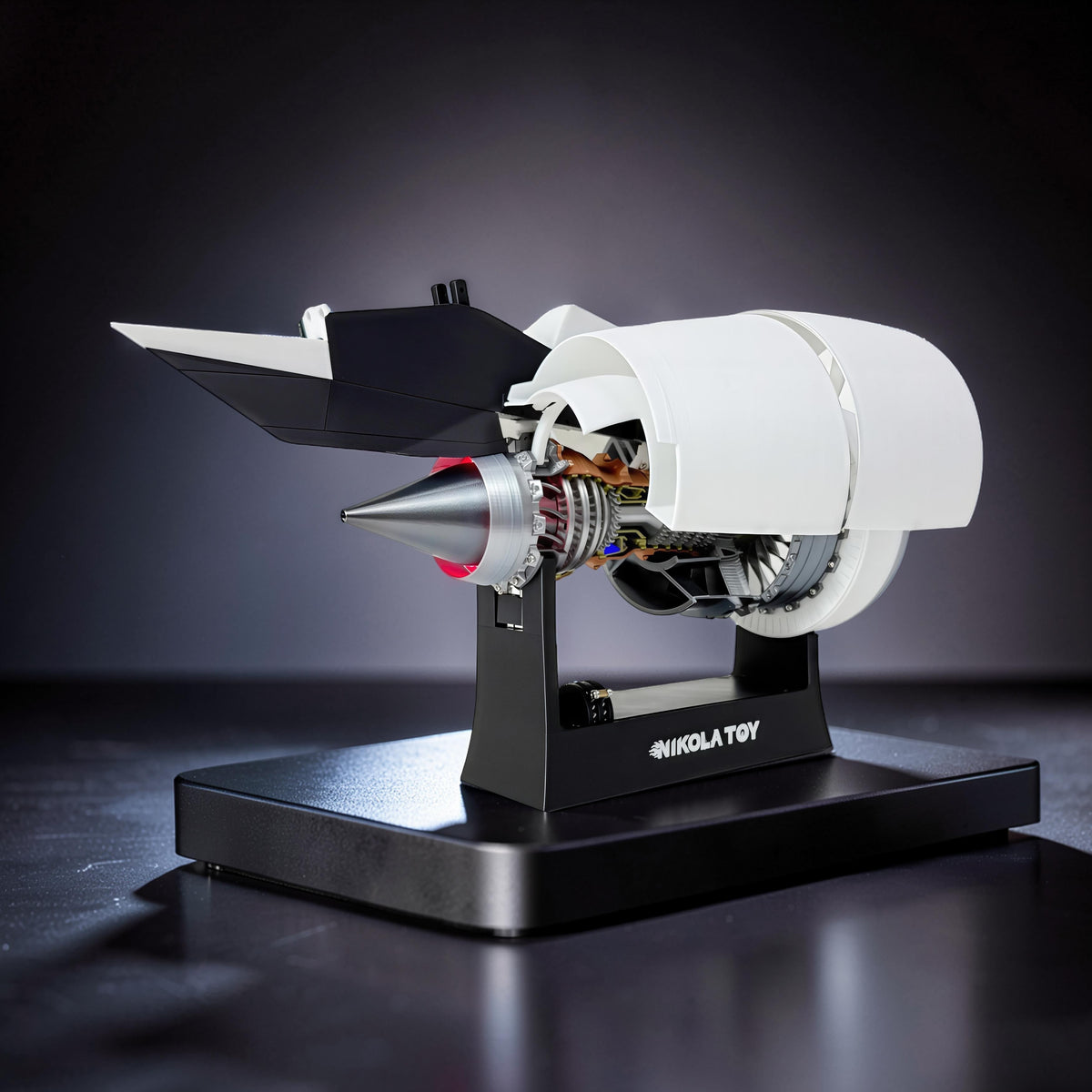 The Curious Mind turbofan engine display model, made of white and black PLA, with mechanical movement and a silver cone.