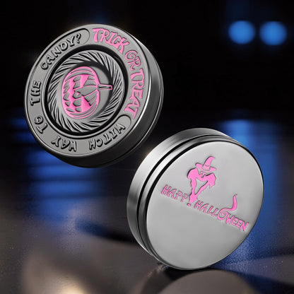 The Curious Mind Evil Pumpkin Haptic Coin Spinner with pink Halloween designs. Metal EDC fidget toy.
