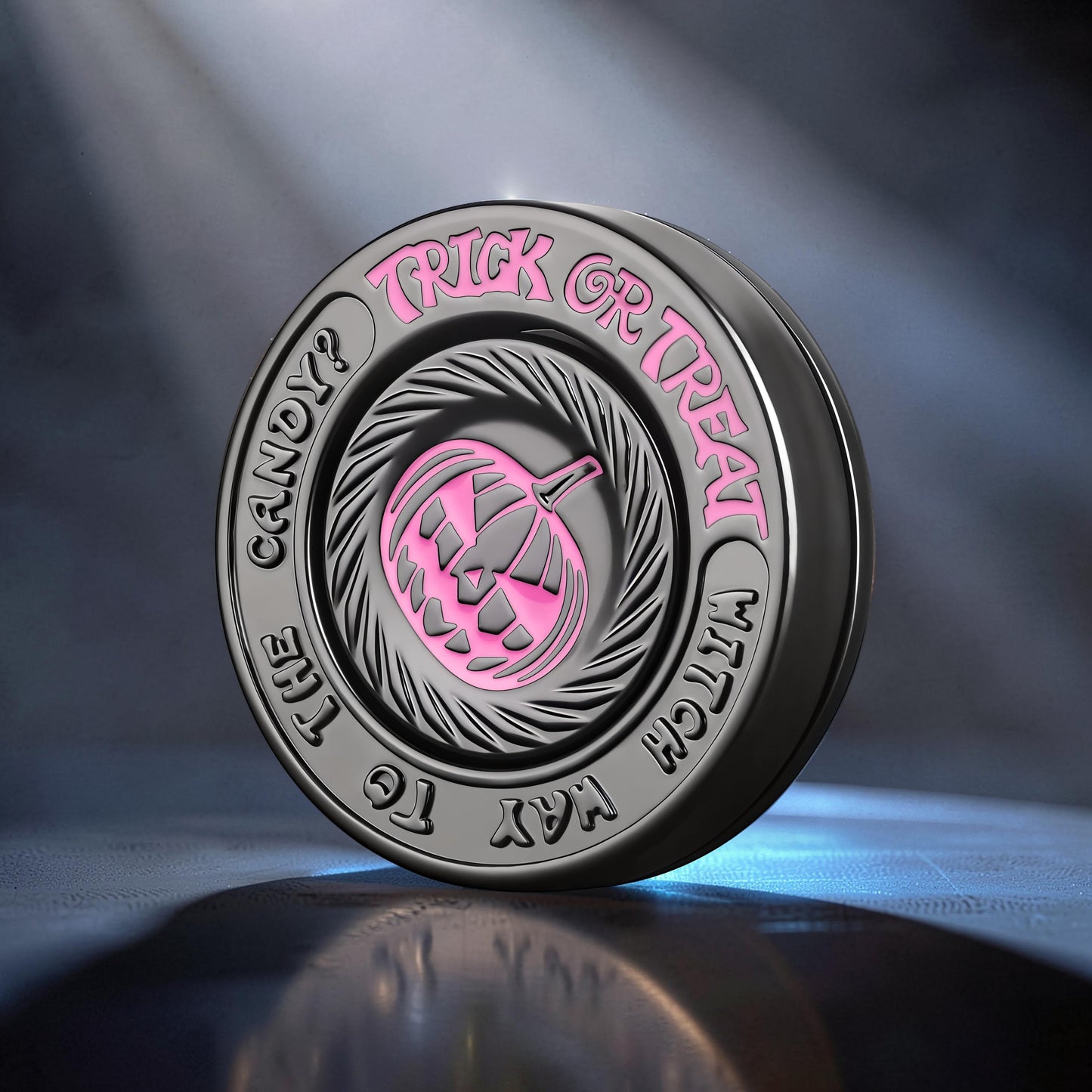 The Curious Mind Evil Pumpkin Haptic Coin Spinner with pink pumpkin and text 'Trick or Treat'.