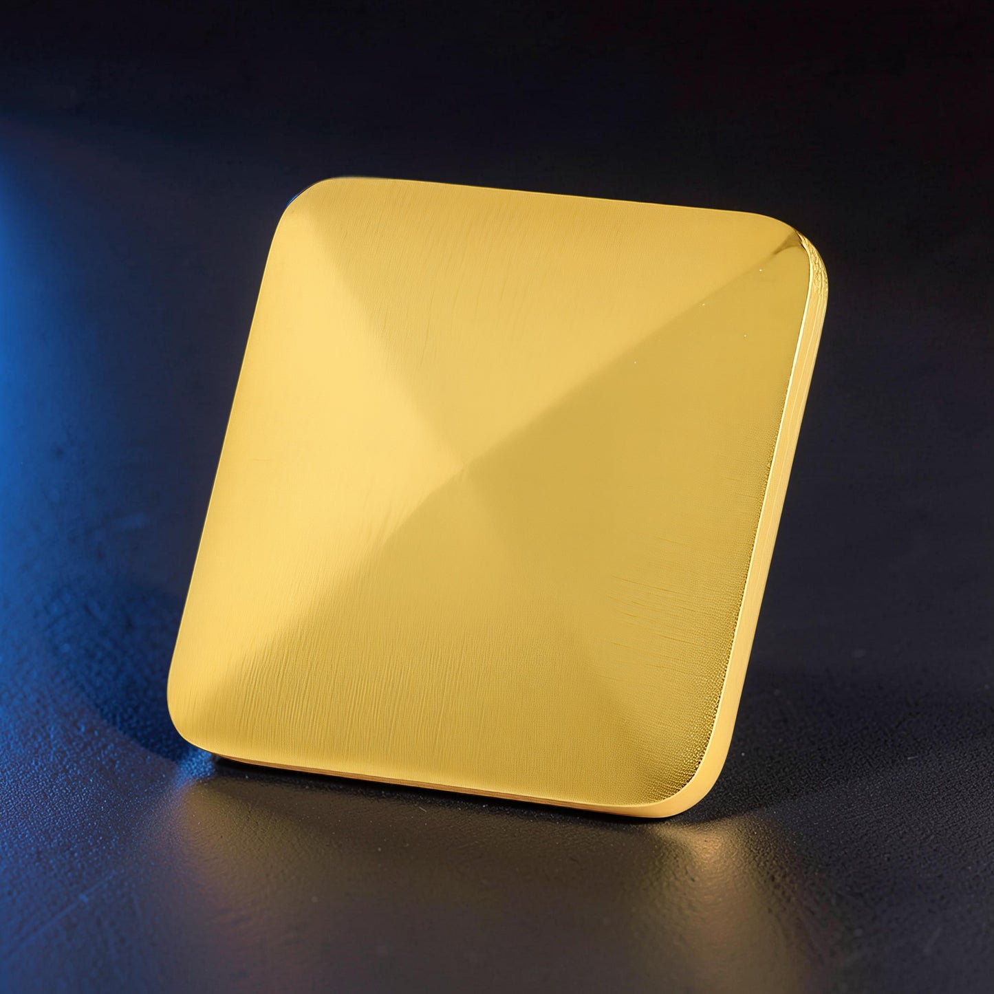 The Curious Mind Flipo Flip Square Desk Spinner, a gold brushed aluminum kinetic sculpture with a faceted design.