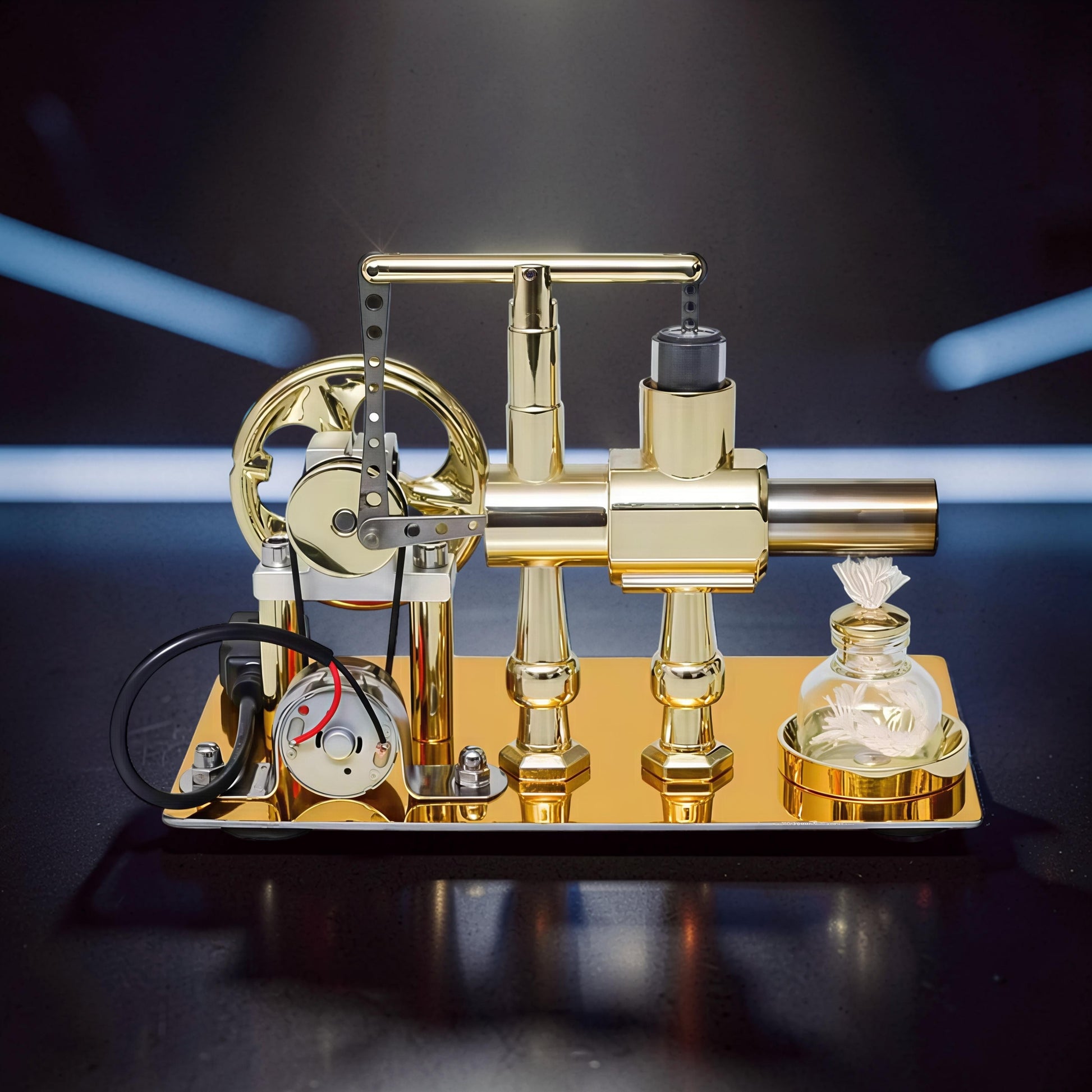 The Curious Mind Stirling Engine Model, a polished gold metal mechanical engine with a flywheel, generator, and LED light, on a display base.