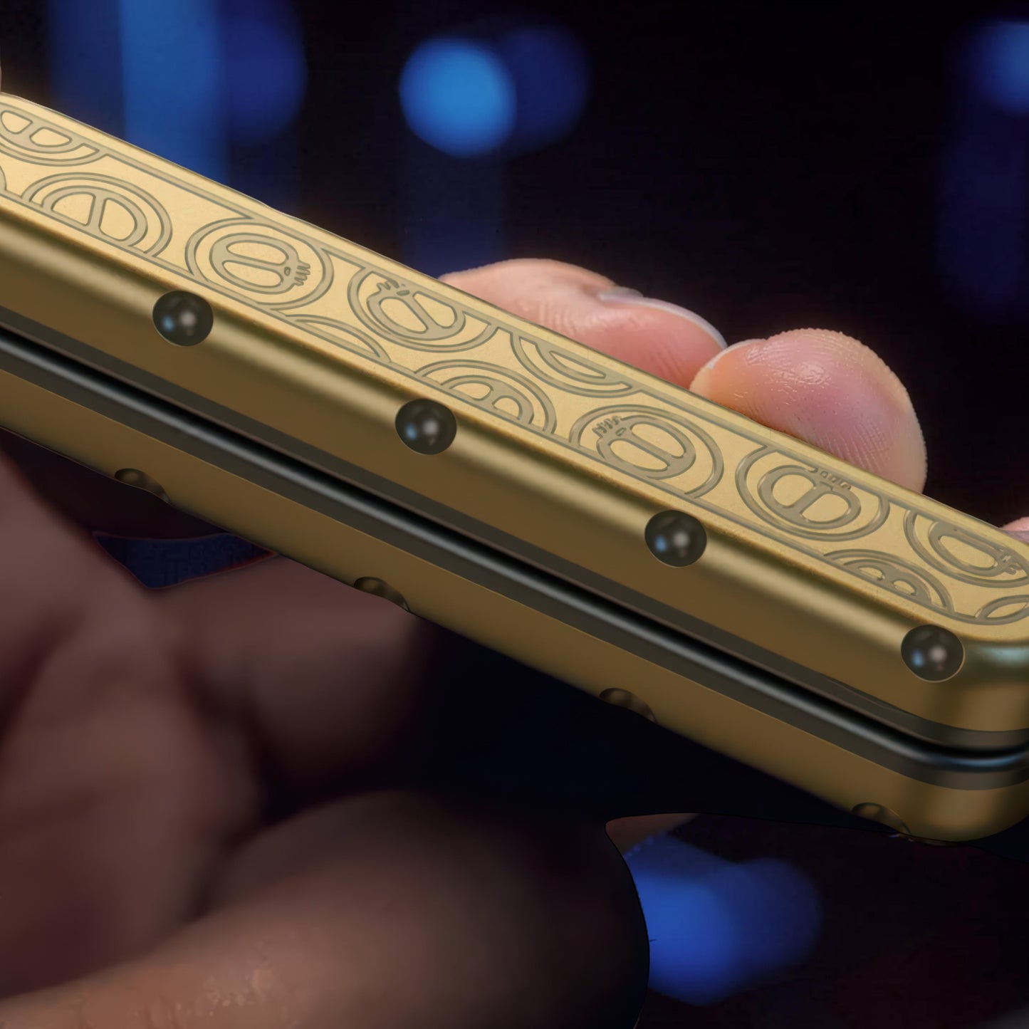 The Curious Mind Deep-Fried Dough Stick magnetic slider fidget toy in gold with a slim bar design and engraved pretzel pattern.