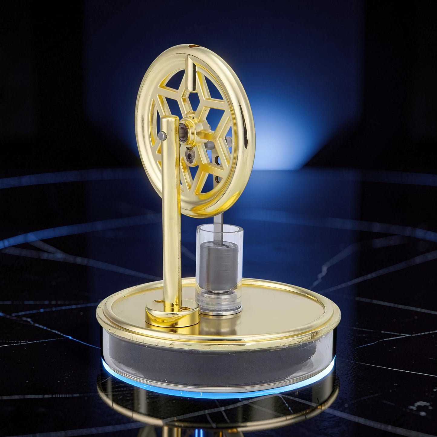 The Curious Mind gold metal Stirling engine display model with a decorative flywheel and glass cylinder.