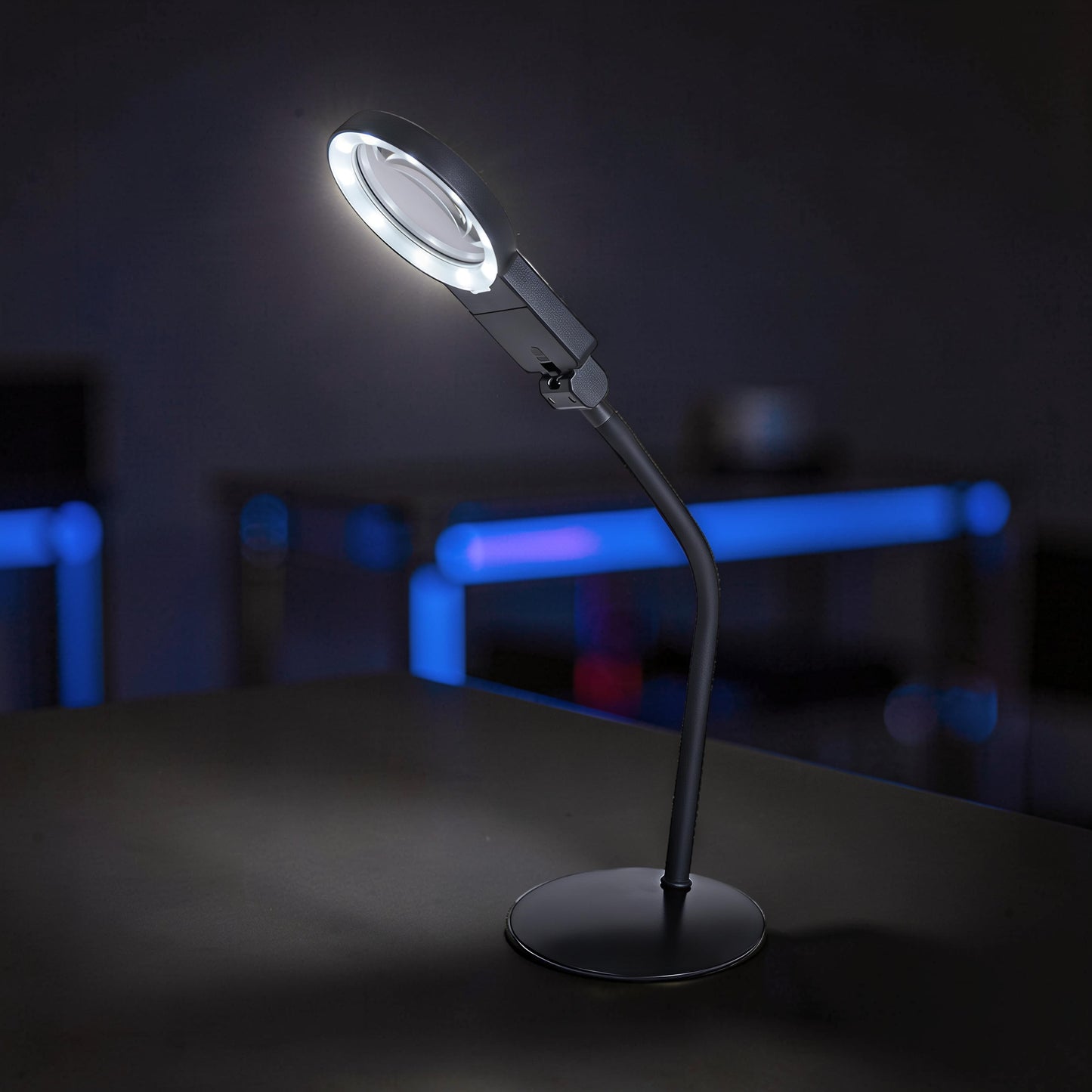 The Curious Mind Gooseneck LED magnifier desk lamp with adjustable neck for detailed hobby work.