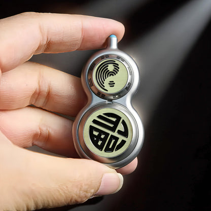 The Curious Mind Cucurbit Gourd Spinner, a premium metal EDC fidget toy with a yin-yang symbol and Chinese character design.