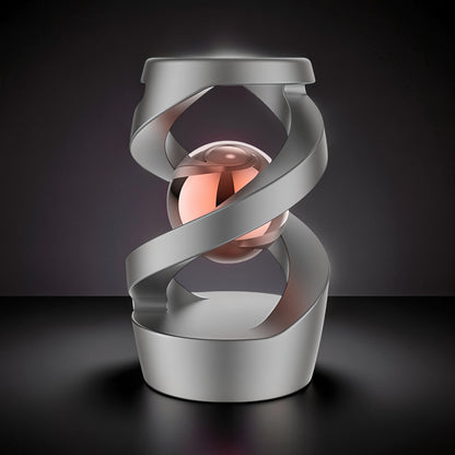 The Curious Mind Hypnosis Rotary Desk Spinner, a metallic desk toy with a rose gold sphere encased in silver swirling metal.