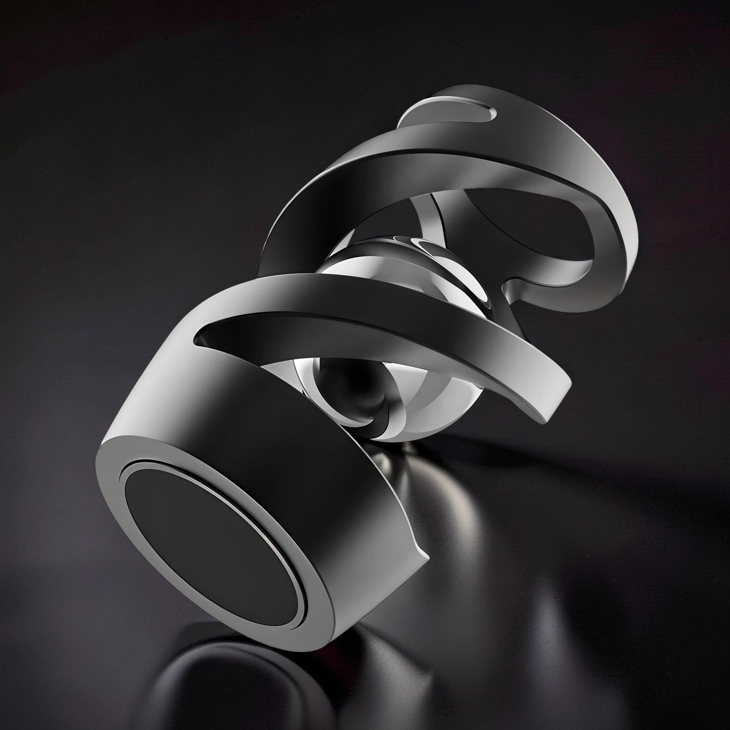The Curious Mind Hypnosis Rotary Desk Spinner, a weighted metal desk toy with a hypnotic swirling design and a polished silver sphere at its core.
