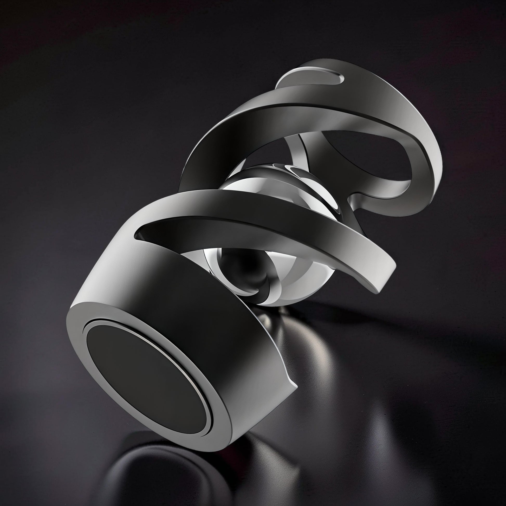 The Curious Mind Hypnosis Rotary Desk Spinner, a weighted metal desk toy with a hypnotic swirling design and a polished silver sphere at its core.