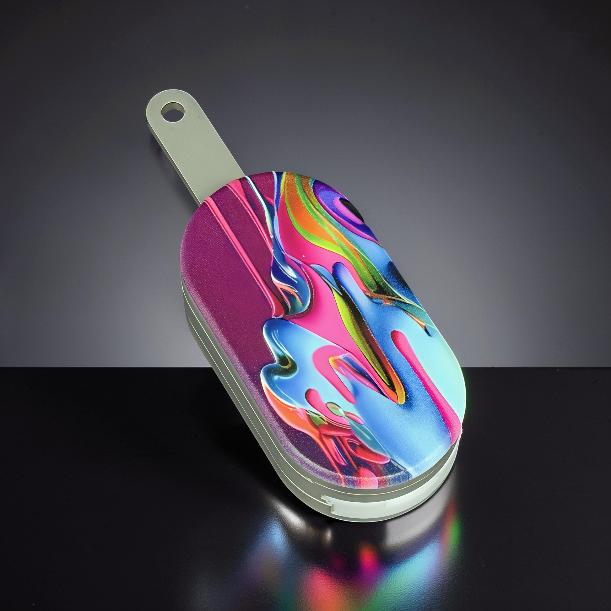 The Curious Mind Ice Cream Push Card Clicker fidget toy with vibrant abstract paint splatter design. Metal construction.