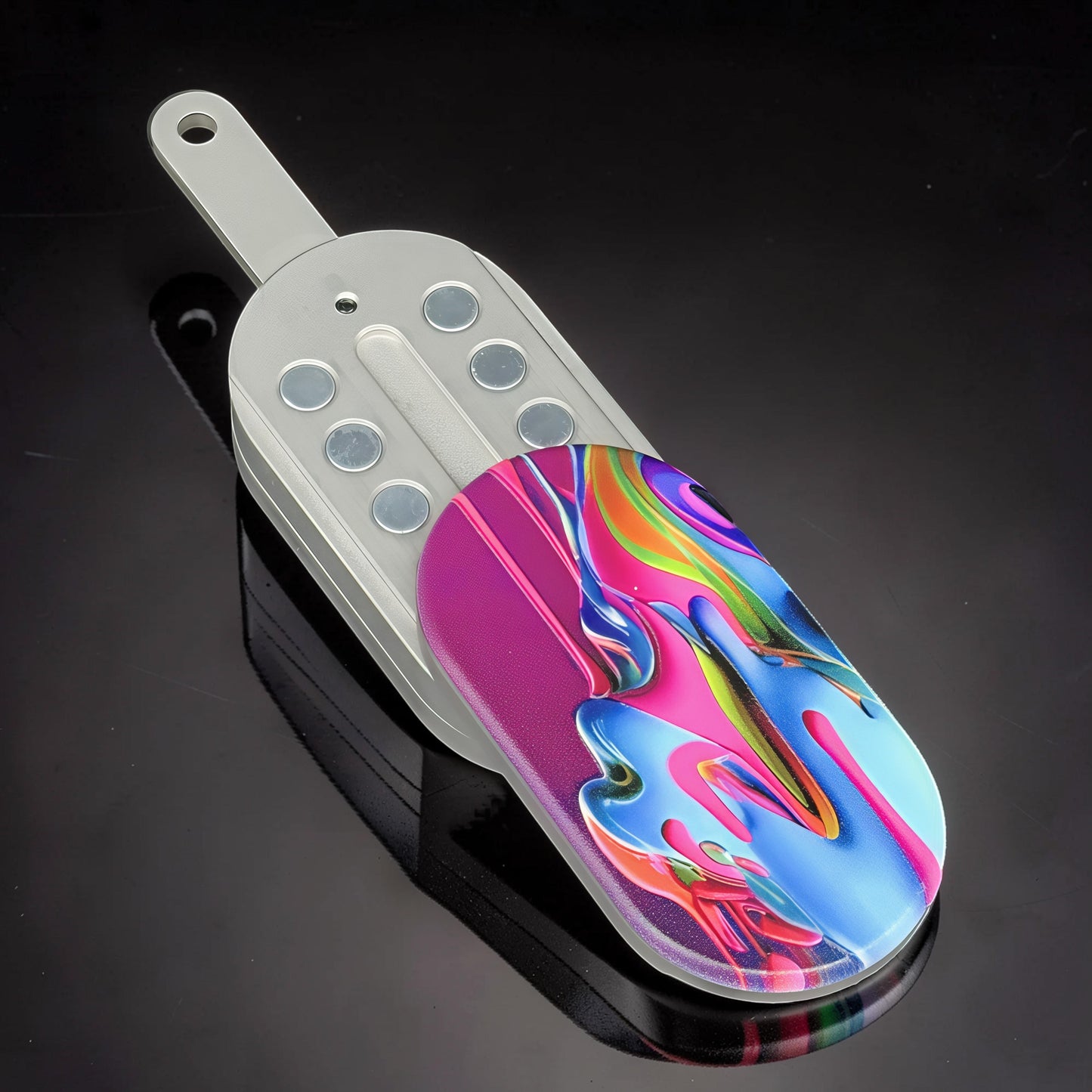 The Curious Mind Ice Cream Push Card Clicker fidget toy with a colorful abstract design and metal casing.
