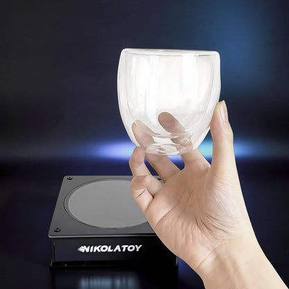 The Curious Mind Inert Gas Lightning Cup with display base, clear double-walled glass, interactive science display.